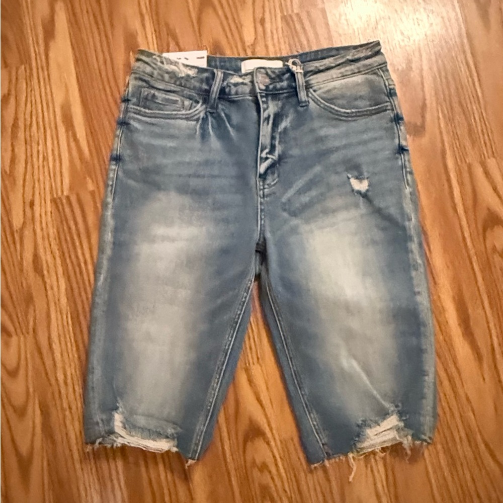 Vervet medium Valerie Bermuda length distressed denim shorts.